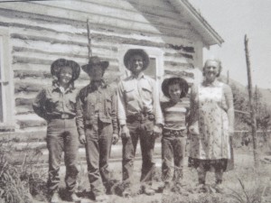 Black-and-white photos on interpretive signs show Rial Chew and his family in 1955.